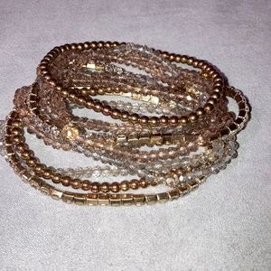 Gold color bracelets.